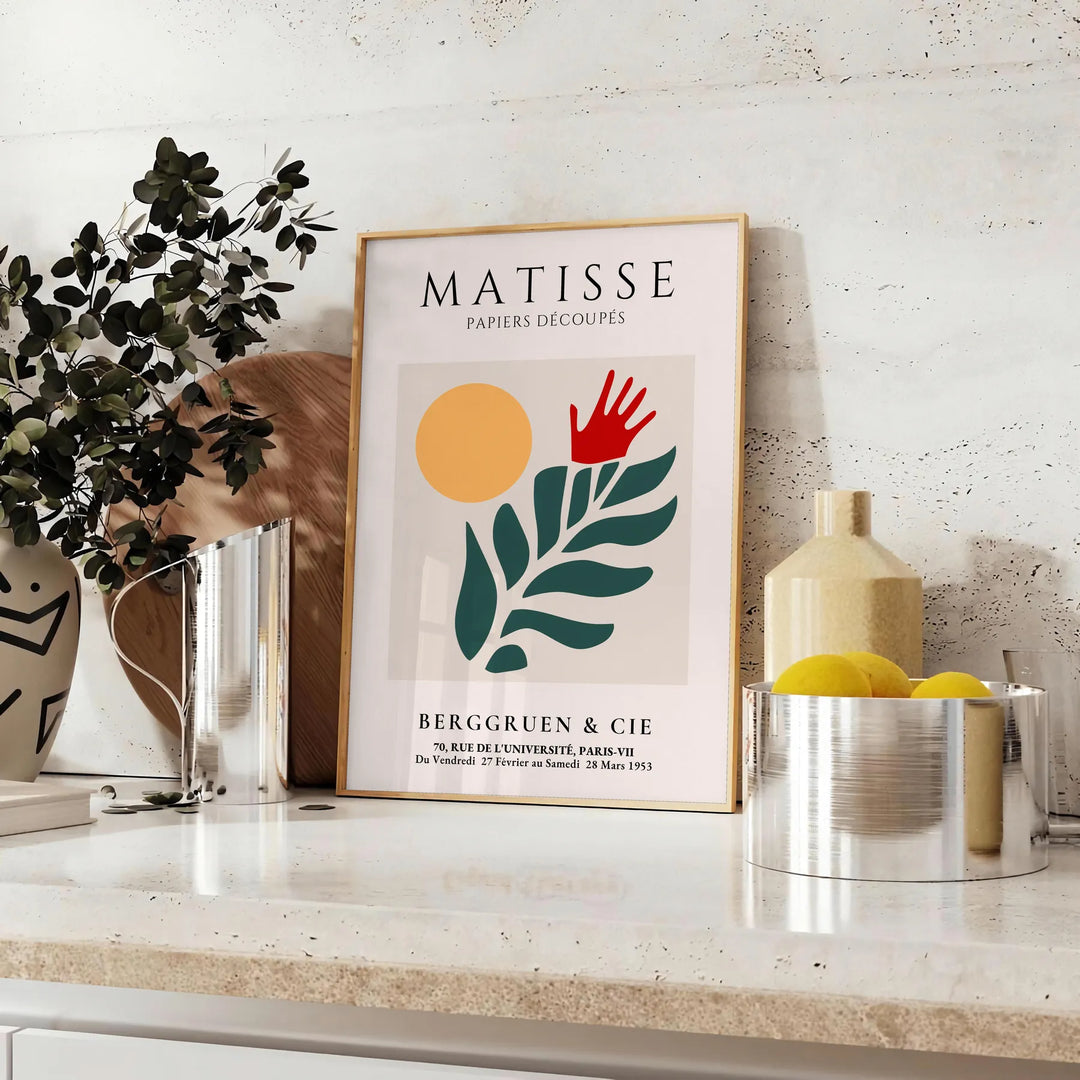Matisse's paper cut-out artwork featuring abstract shapes in white and green