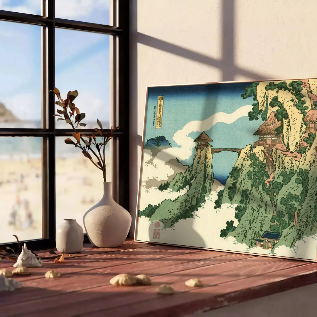 Woodblock-style landscape featuring a bridge shrouded in clouds