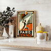 Art Deco style poster featuring tennis players at the 1924 Paris Olympics - styled on a counter with eucalyptus and a bowl of lemons