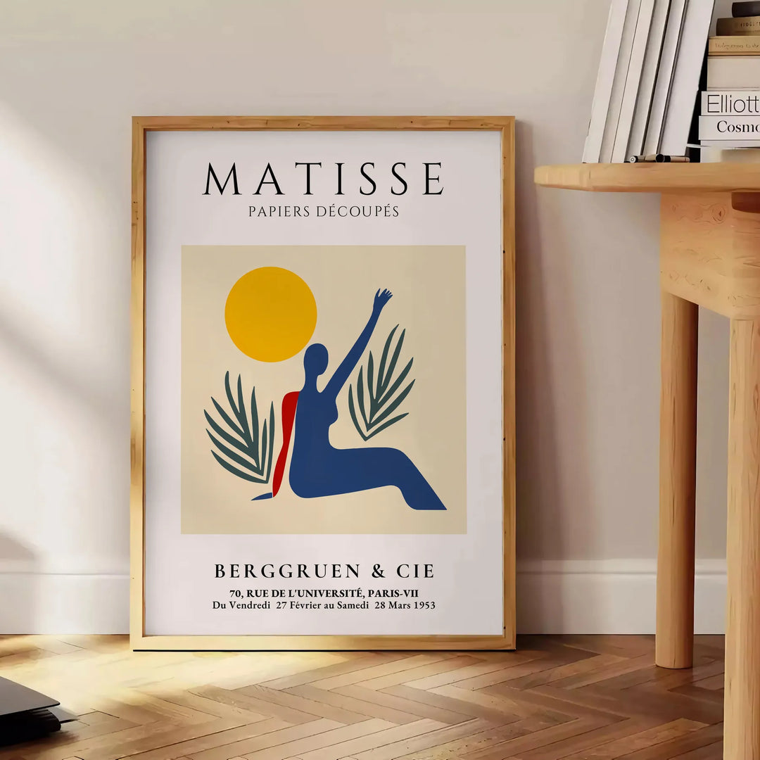 Poster showing Matisse paper-cut woman in orange and red tones