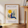 Poster showing Matisse paper-cut woman in orange and red tones