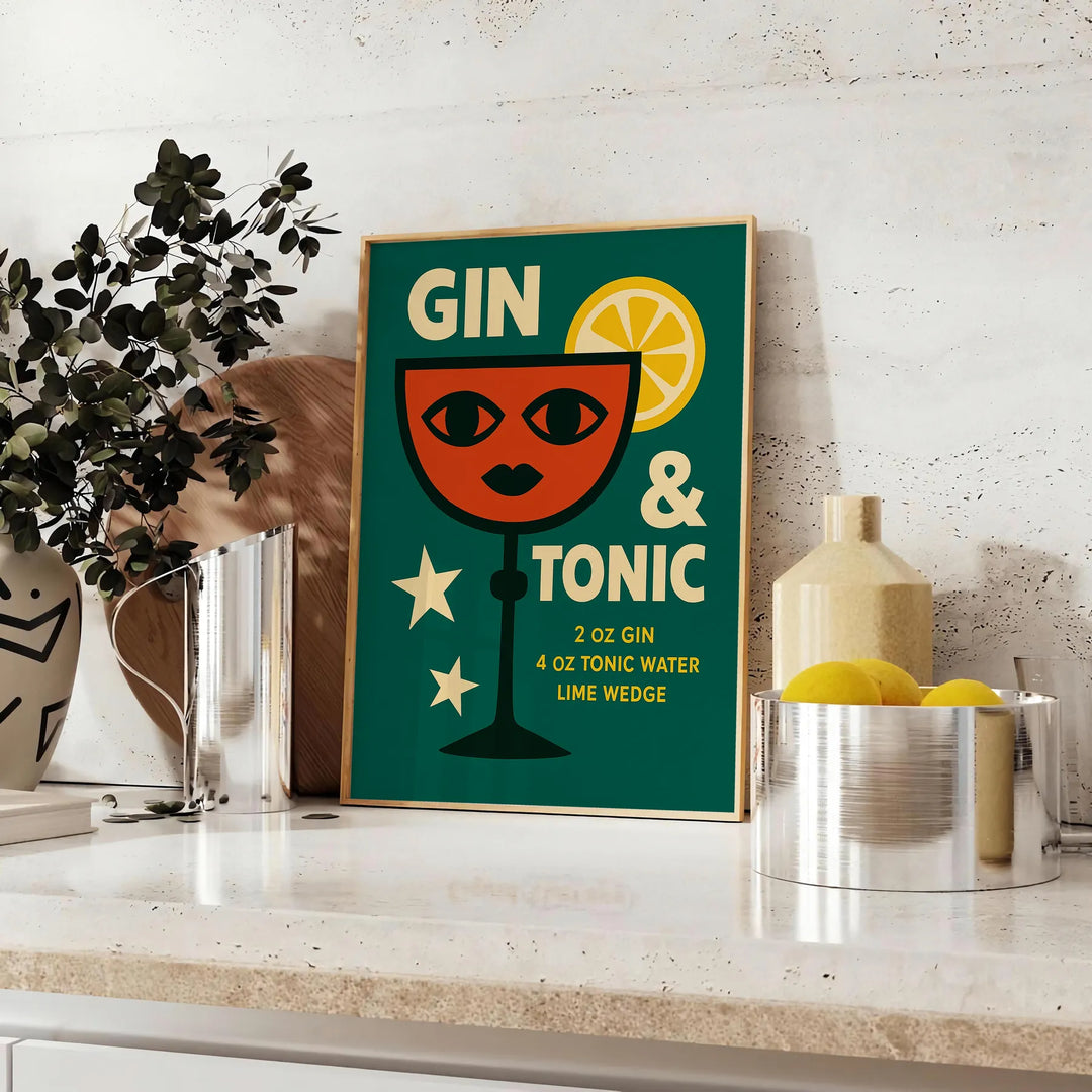 A gin and tonic cocktail with orange zest and green garnishes