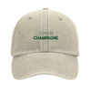 Cap featuring an embroidered vintage tennis design with champagne elements
