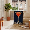 Colorful illustration of a Cosmopolitan cocktail with orange and gray splashes