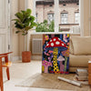 Colorful mushroom with polka dots by Yayoi Kusama, featuring green and black hues