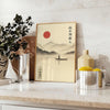 Minimalist artwork featuring a Japanese sun above a mountain and a boat in gray and orange
