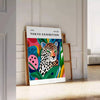 Portrait of a woman by Yayoi Kusama with green and orange polka dots