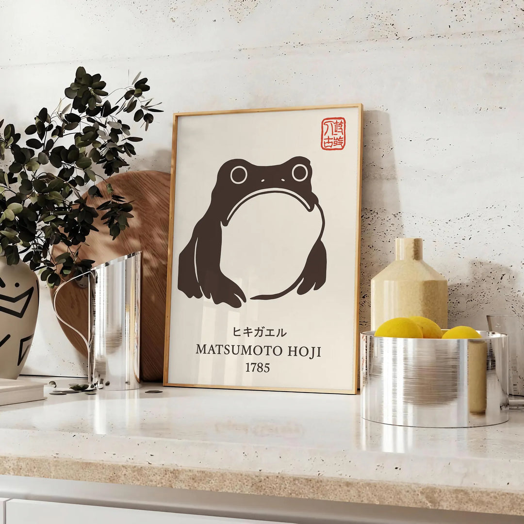 Japanese poster featuring a frog surrounded by blue waves and earthy tones