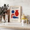 Poster showing Matisse cut-paper composition in white and gray tones