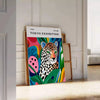 Vintage leopard illustration on an orange and green background in mid-century style