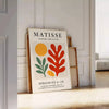 Poster showing Matisse Papiers Découpés green and orange cut-paper collage