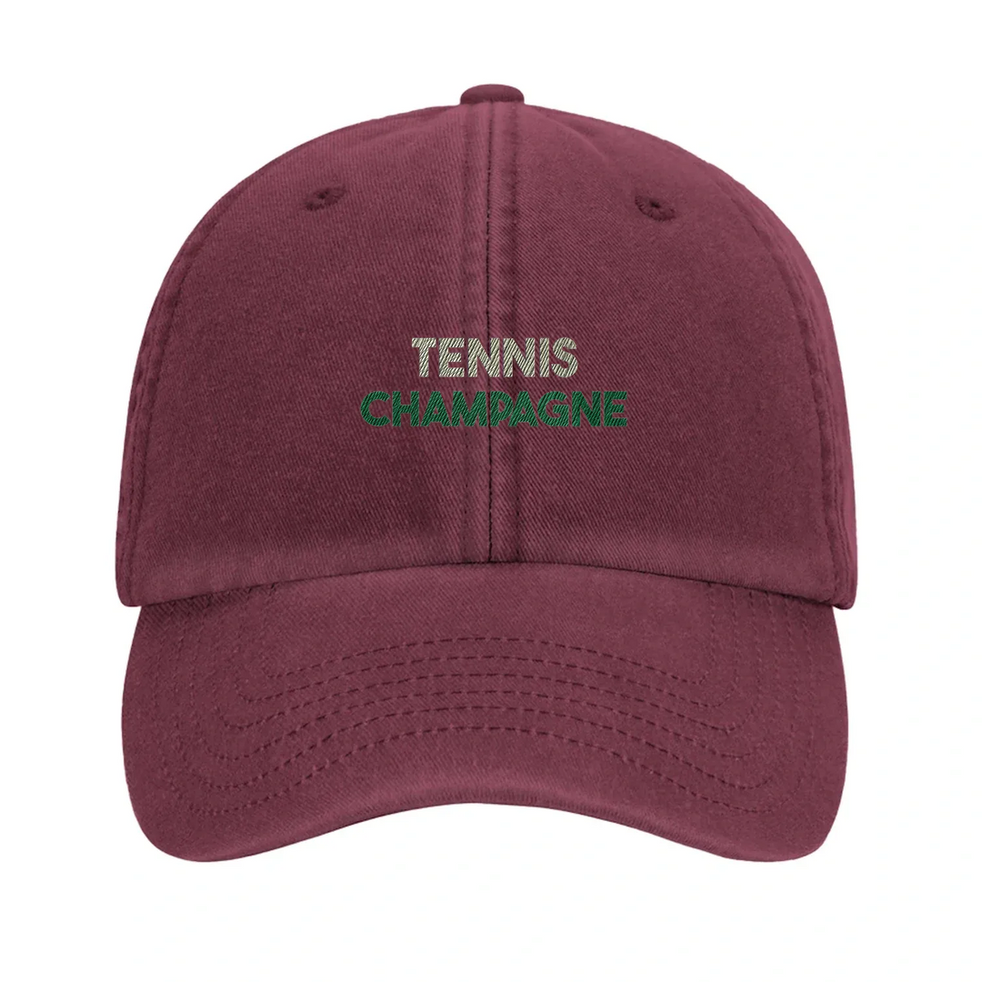 Cap featuring an embroidered vintage tennis design with champagne elements