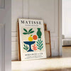 Plakat mit Matisse Scherenschnitt-Kunst in Weiß und Orange