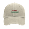 Embroidered cap featuring a vintage tennis design with champagne elements