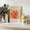 Forme ritagliate astratte in nero e arancione di Matisse