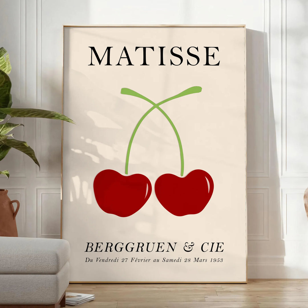Red and orange paper-cut cherries in a mid-century style