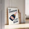 Minimalist poster featuring the French phrase 'Le Champagne C'est Bon' in green and black