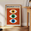 Bauhaus poster featuring stylized eyes in bold orange and green