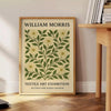 Intricate floral pattern in gray and orange by William Morris