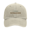Embroidered cap featuring a vintage tennis design with Normandie text