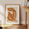 Cutout-style artwork of a nude figure in blue and white tones
