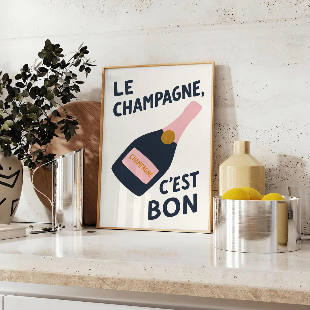 Minimalist poster featuring the French phrase 'Le Champagne C'est Bon' in green and black