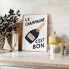 Minimalist poster featuring the French phrase 'Le Champagne C'est Bon' in green and black