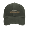 Embroidered cap featuring a vintage tennis design with Normandie text