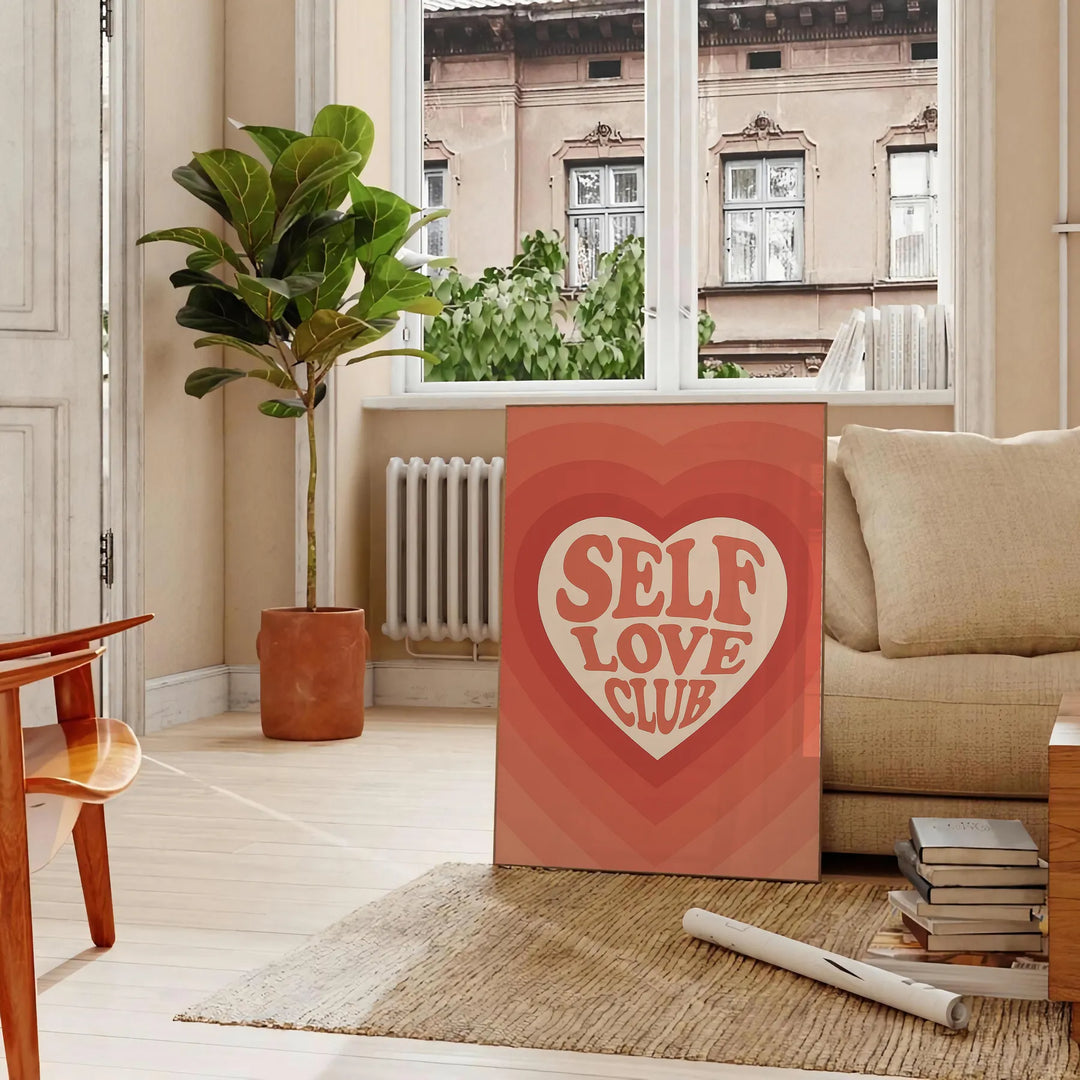 A motivational poster featuring the phrase 'Self Love Club' in bold typography, with energetic orange and red hues.
