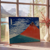Traditional ukiyo-e style depiction of Mount Fuji in green and red