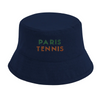 Cap featuring an embroidered graphic of tennis elements inspired by Paris