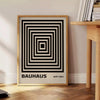 Bauhaus pyramid poster in brown, gray, and green geometric design