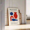 Poster showing Matisse cut-paper composition in white and gray tones