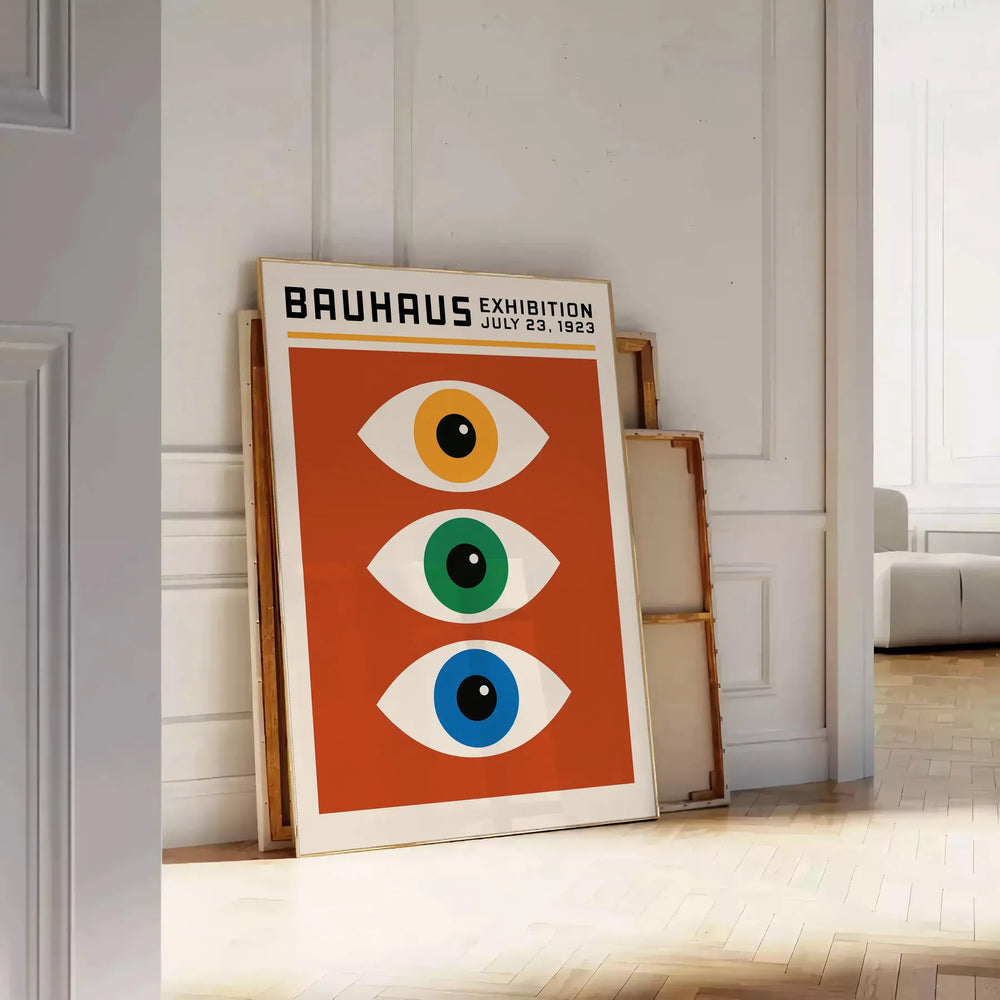 Bauhaus poster featuring stylized eyes in bold orange and green