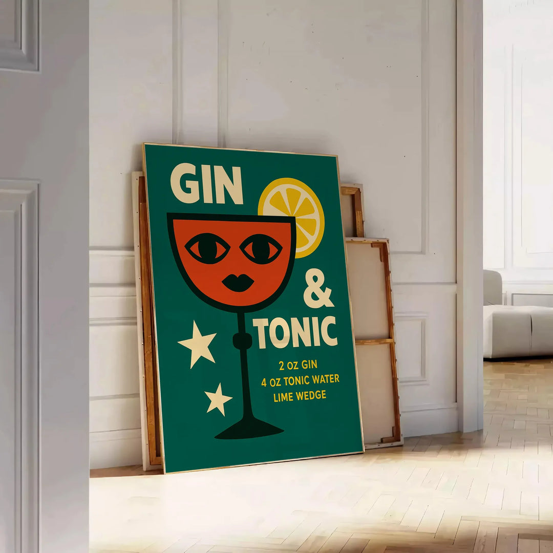 A gin and tonic cocktail with orange zest and green garnishes