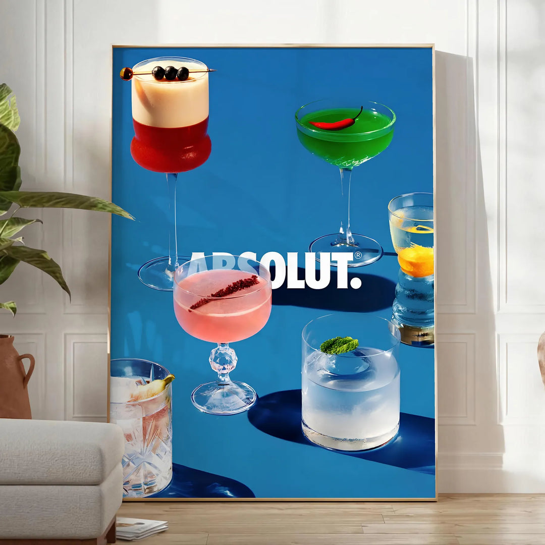 Poster of Absolut cocktail artwork in black and brown minimalist style - in a bright minimalist room with a plant and an armchair