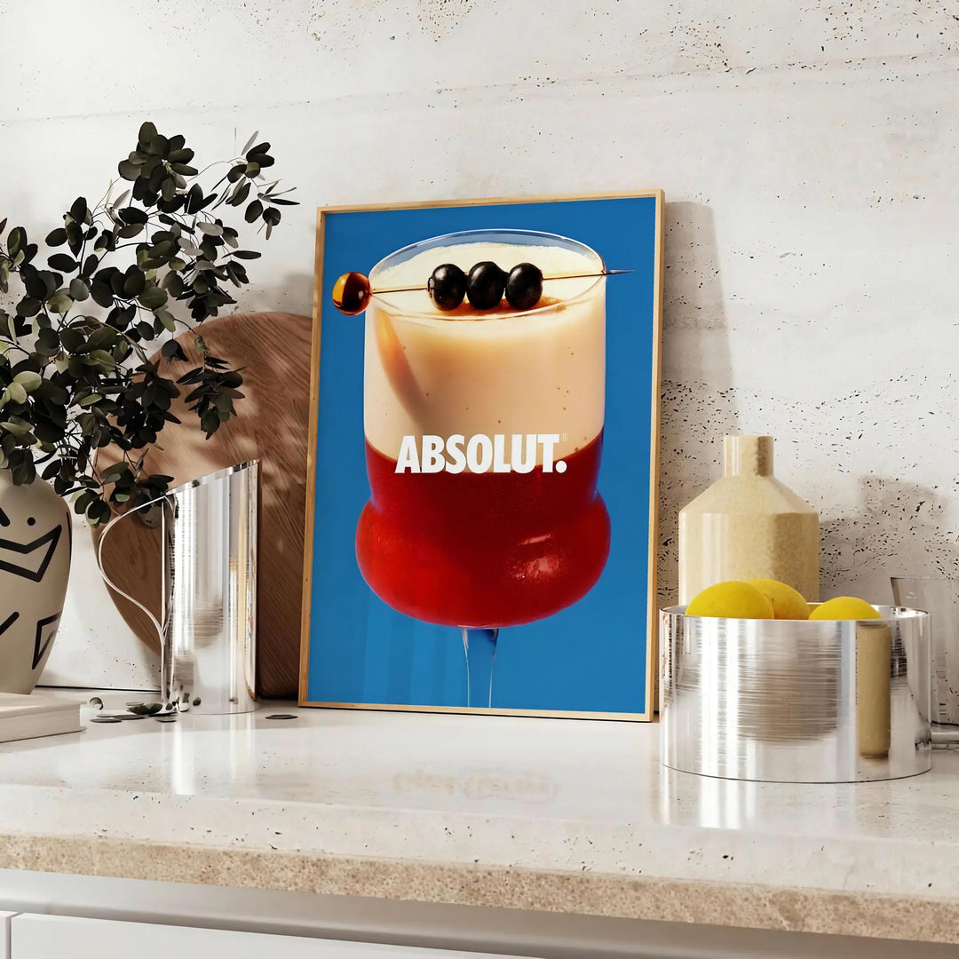 Vintage cocktail illustration featuring brown and blue tones - styled on a counter with eucalyptus and a bowl of lemons