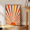 Abstract bohemian art with earthy browns and warm oranges - beside a round wooden side table with books