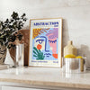 Maximalist abstract art featuring swirling shapes in blue and orange tones - styled on a counter with eucalyptus and a bowl of lemons