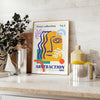 Yellow and orange maximalist abstract events poster with bold layered shapes - styled on a counter with eucalyptus and a bowl of lemons
