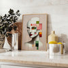 Abstract geometric human poster in orange and red, modern art print - styled on a counter with eucalyptus and a bowl of lemons