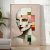 Abstract geometrical human poster in red and green, minimalist artwork - in a bright minimalist room with a plant and an armchair