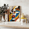 Abstract woman poster in bold black and orange, contemporary minimalist portrait - styled on a counter with eucalyptus and a bowl of lemons
