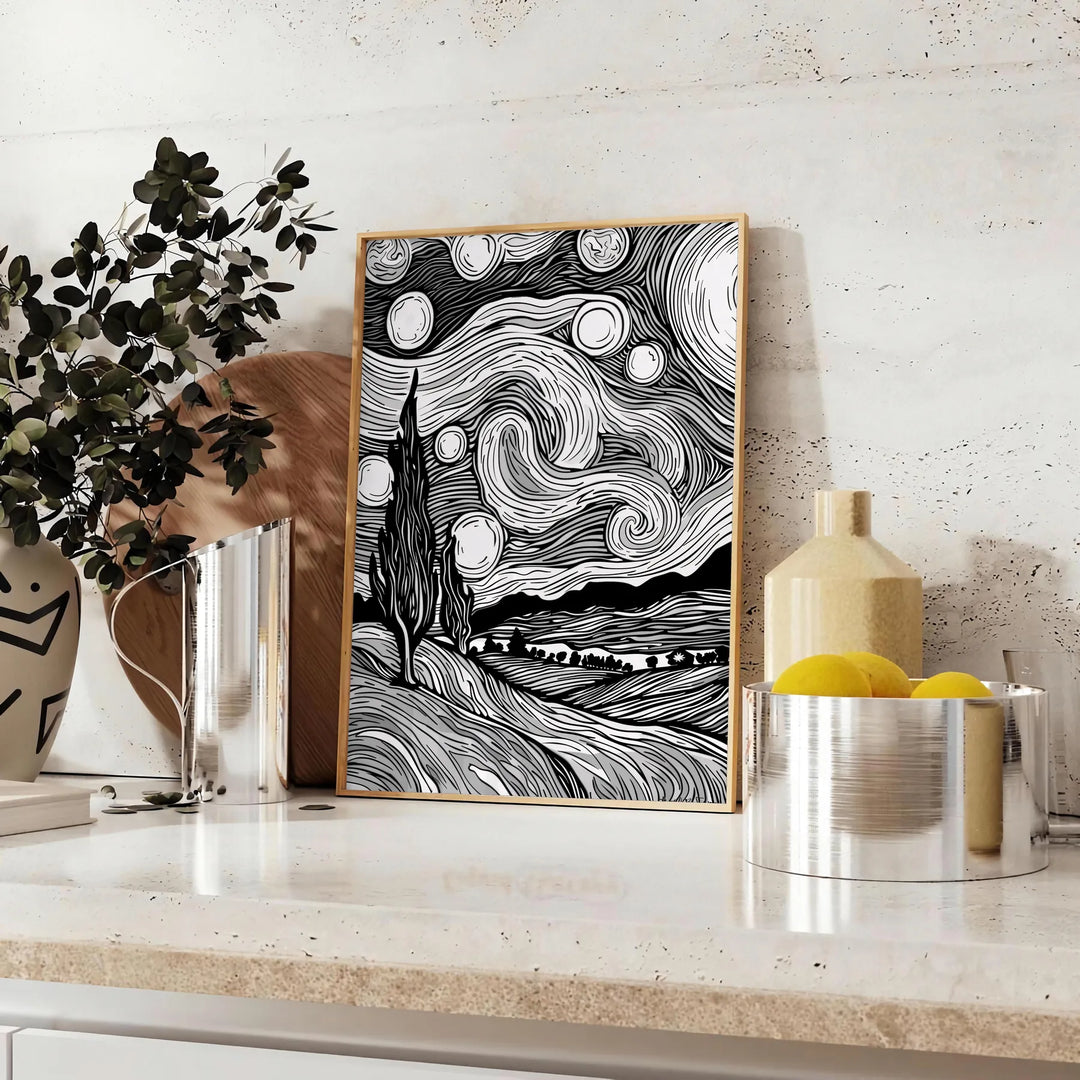 Abstract black and gray line art with flowing, minimalist shapes - styled on a counter with eucalyptus and a bowl of lemons
