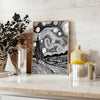 Abstract black and gray line art with flowing, minimalist shapes - styled on a counter with eucalyptus and a bowl of lemons