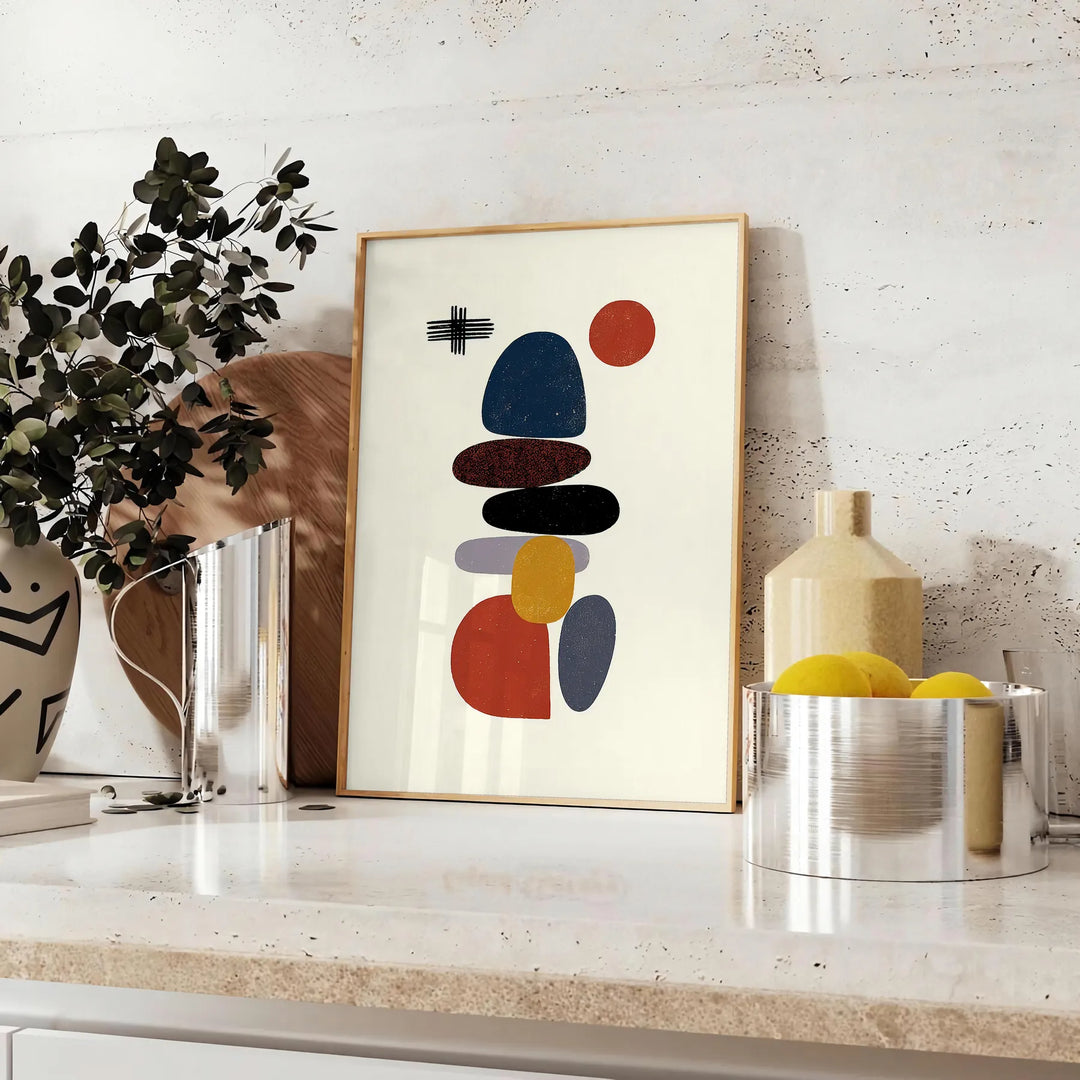 Minimalist Scandinavian abstract poster with orange and white geometric shapes - styled on a counter with eucalyptus and a bowl of lemons