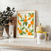 Green and white citrus kitchen poster, minimalist watercolor-style artwork - styled on a counter with eucalyptus and a bowl of lemons