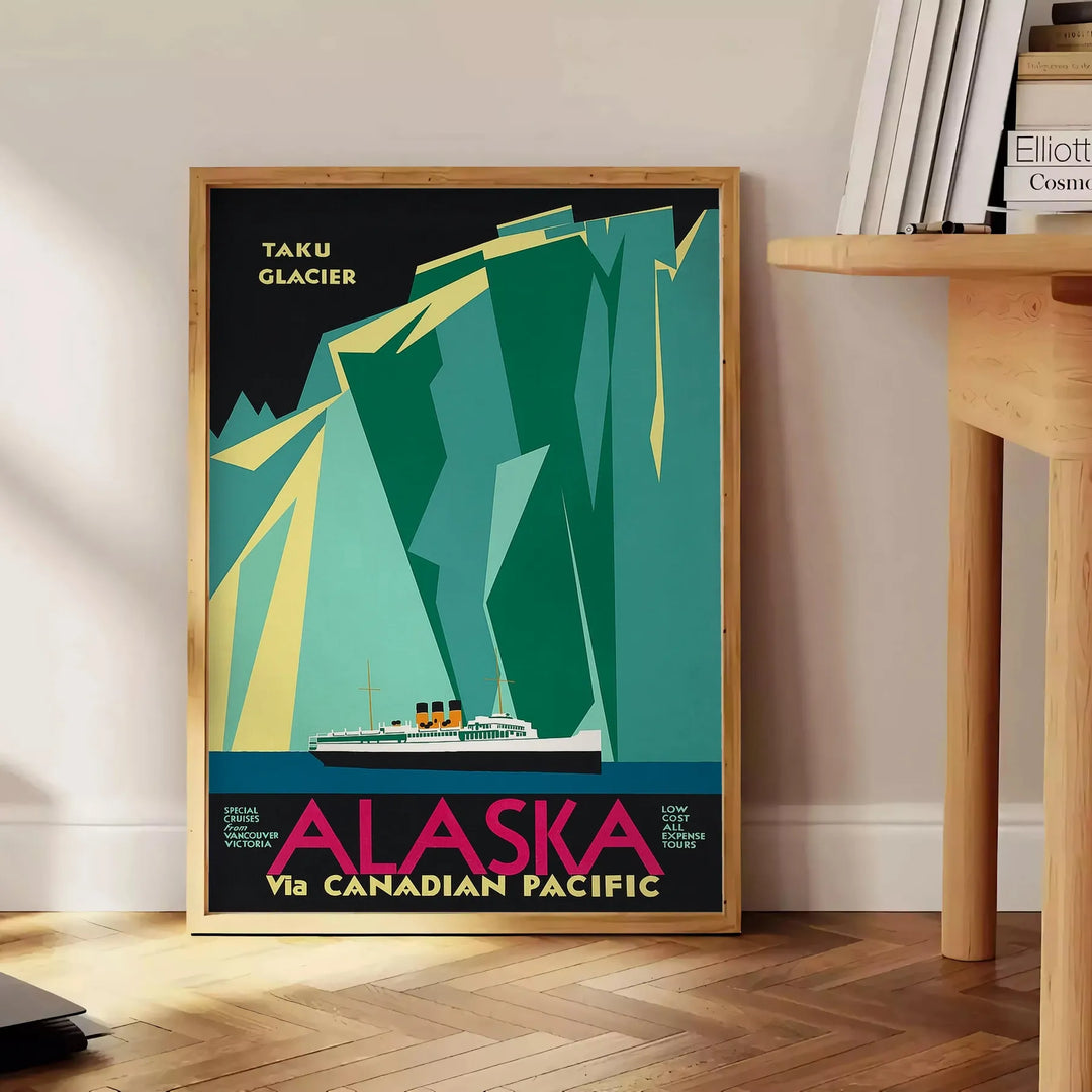 Stylized mountains and forest in shades of green and blue - beside a round wooden side table with books