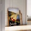 Stylized depiction of Amalfi Coast cliffs and sea in green and black - leaning on a herringbone floor against a white panelled wall