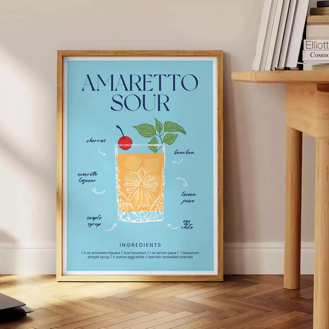 Illustration of an Amaretto Sour cocktail with splash effects in blue and yellow - beside a round wooden side table with books